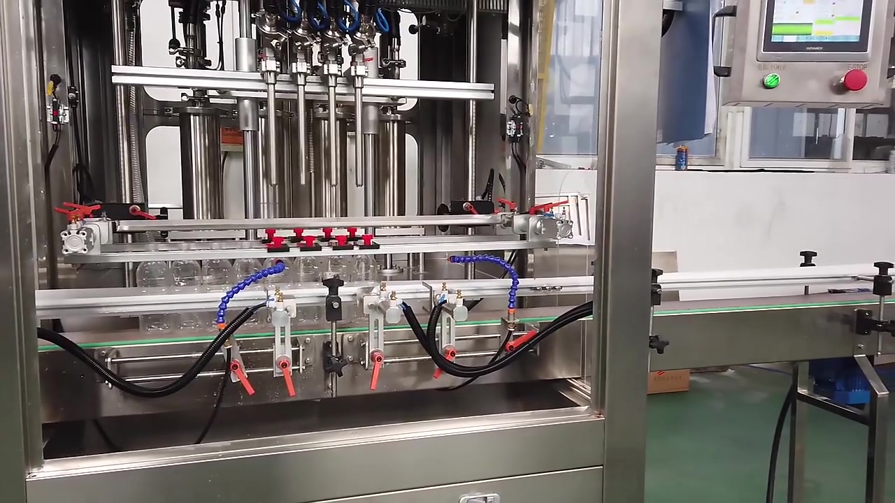 Machine automatique de remplissage de bouteilles de savon liquide à 4 buses